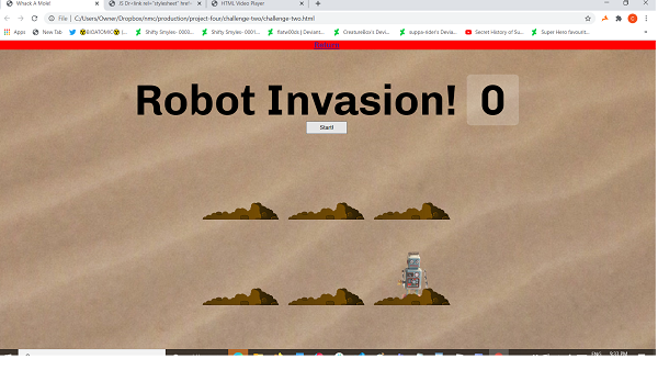 An image of the 'Robot Invasion' game. There are six holes in which robots pop out of.