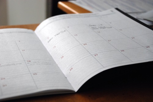 An open calender on a desk.