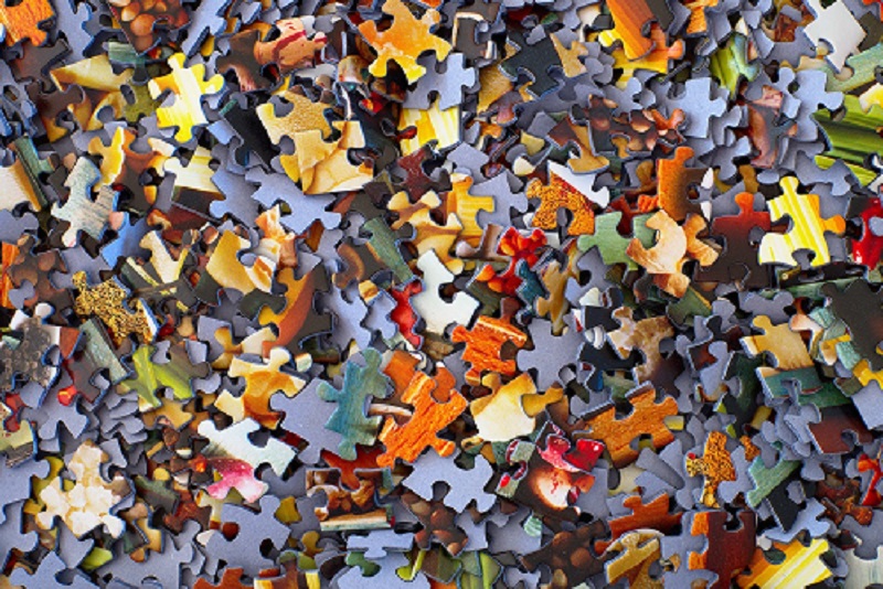 A jumbled pile of puzzle pieces.